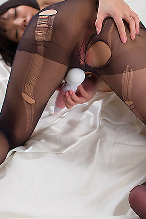 Luna Kobayashi wears a pantyhose as she teases the viewer with her pussy